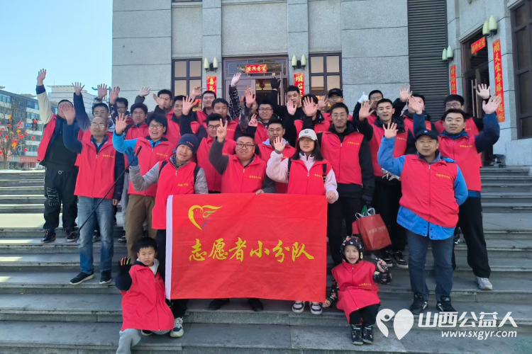 太原市志愿者小分队组织志愿者参加学雷锋活动在小商品市场路段清理环境卫生 - 第1张