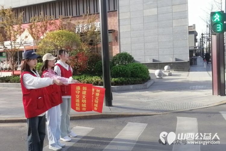 临汾市文明交通志愿者协会与交警共同携手为考生创造安全的交通环境提供保驾护航的服务 - 第6张