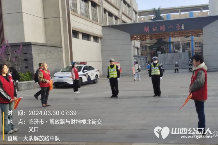 临汾市文明交通志愿者协会与交警共同携手为考生创造安全的交通环境提供保驾护航的服务 - 第4张
