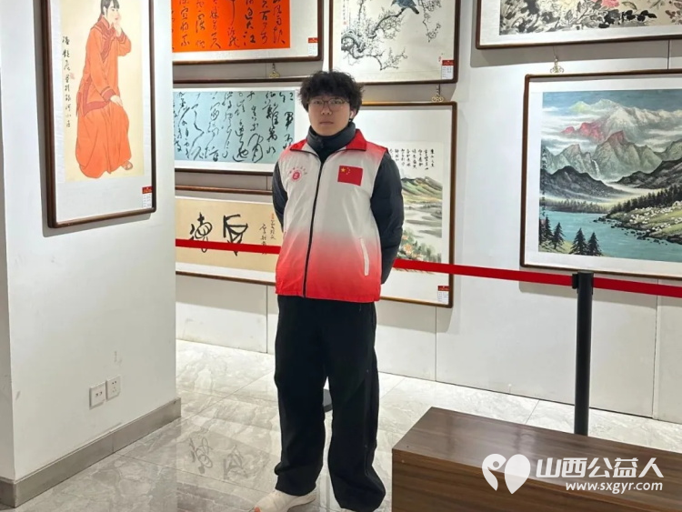 长治市正能量公益协会组织大学生志愿者在首届正能量公益书画作品展展览期间开展志愿服务活动 - 第7张