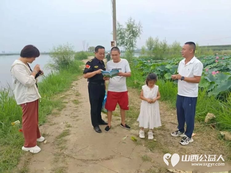 忻州市环保志愿者协会志愿者在全国生态日开展环保宣传活动走进忻府区金山湖景区普及生态环保法律法规与政策 - 第6张