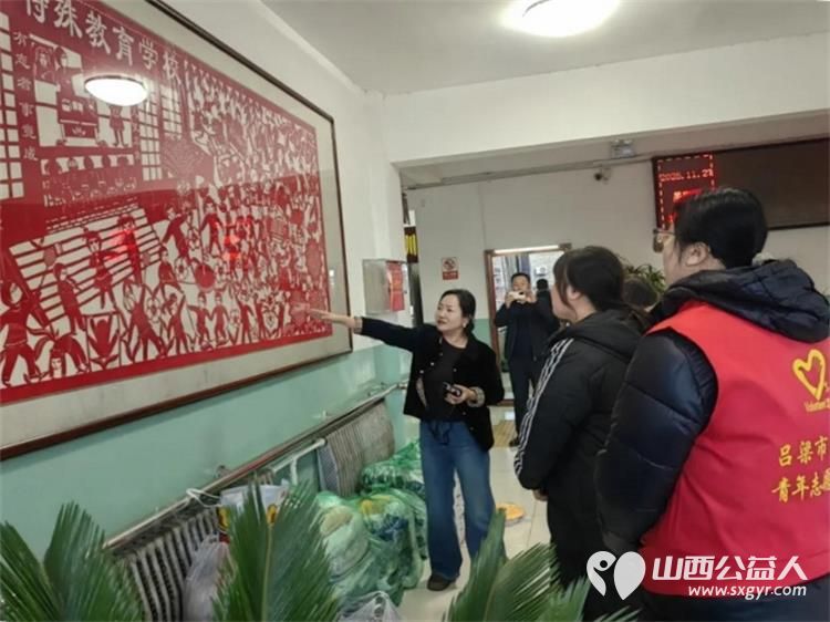 共青团伙伴计划--这个冬天因爱不再寒冷 吕梁市离石区青年志愿者协会联合尉汾路社区走进吕梁市特殊教育学校开展衣旧情深与爱同行冬日关怀活动 - 第6张