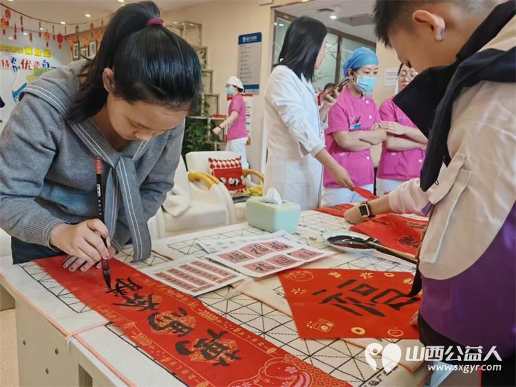太原市儿童友好促进会组织志愿服务活动联合怡静阁书法、盛大齿科为社区长者送去春节祝福 - 第5张