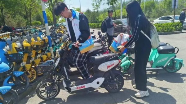晋中新青年高校志愿者联合服务中心五一志愿服务嘉年华 之 单车公约安全出行规范停车志愿服务活动